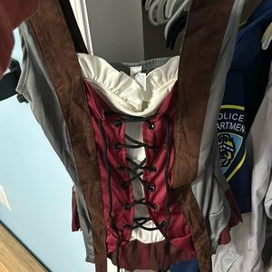 Female pirate top (has been cut from longer skirt) with two arm cuff sleeves